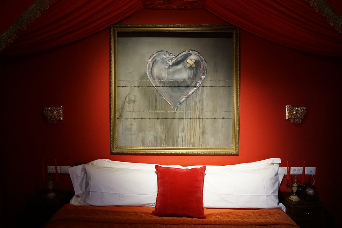 Interior of the Walled Off Hotel, Bethlehem. Every surface is a Banksy artwork. Photo courtesy Banksy