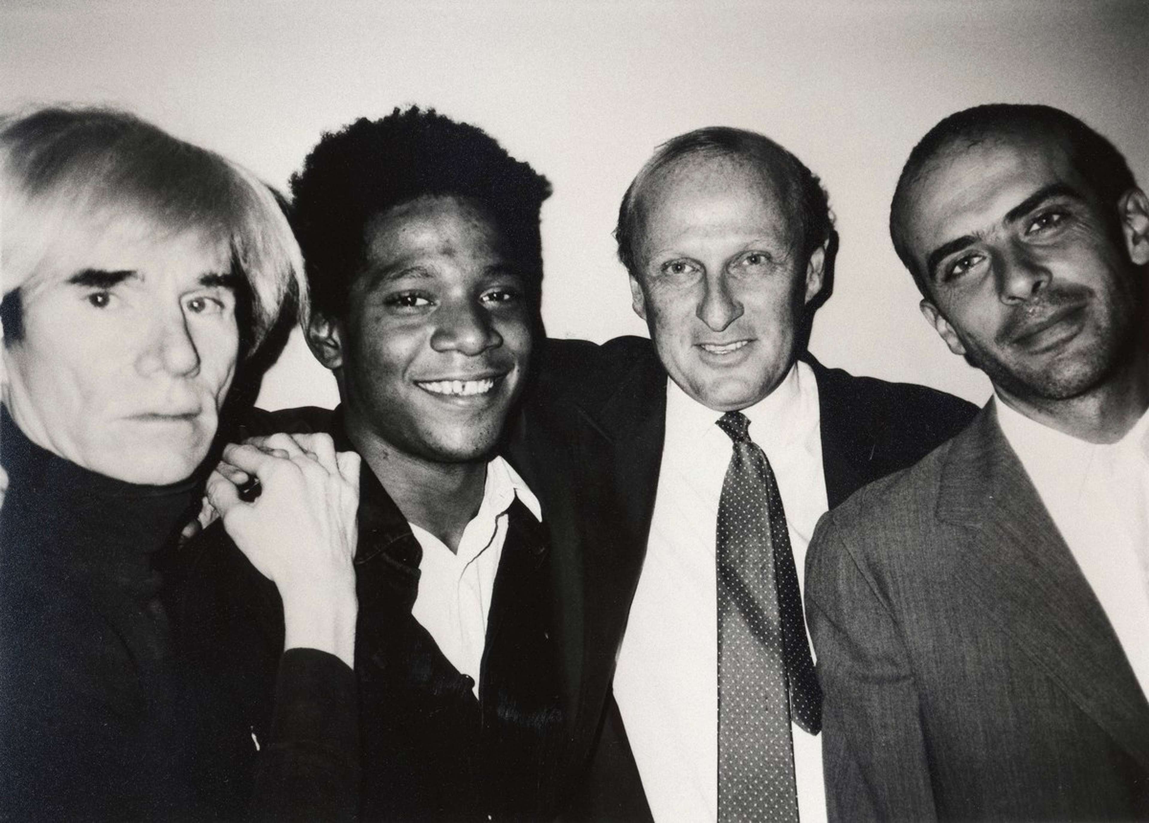 Image © Galerie Bruno Bischofberger, CC BY-SA 4.0, via Wikimedia Commons / Andy Warhol, Jean-Michel Basquiat, Bruno Bischofberger and Fransesco Clemente, New York, 1984